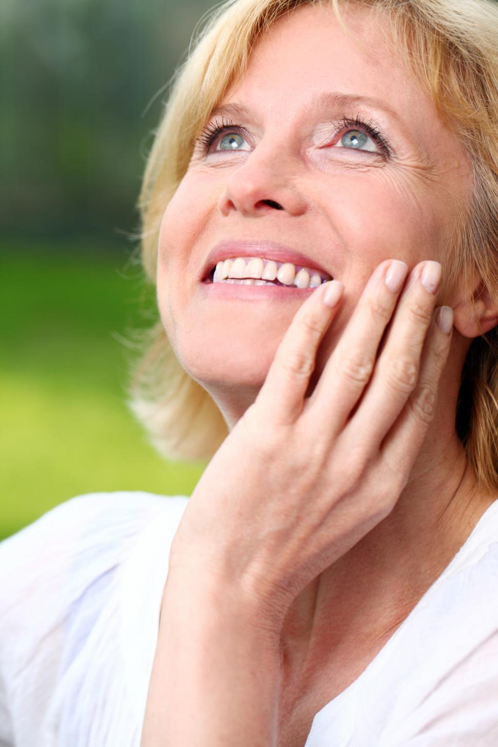 Free Image of Beautiful middle aged woman outdoors in the park 