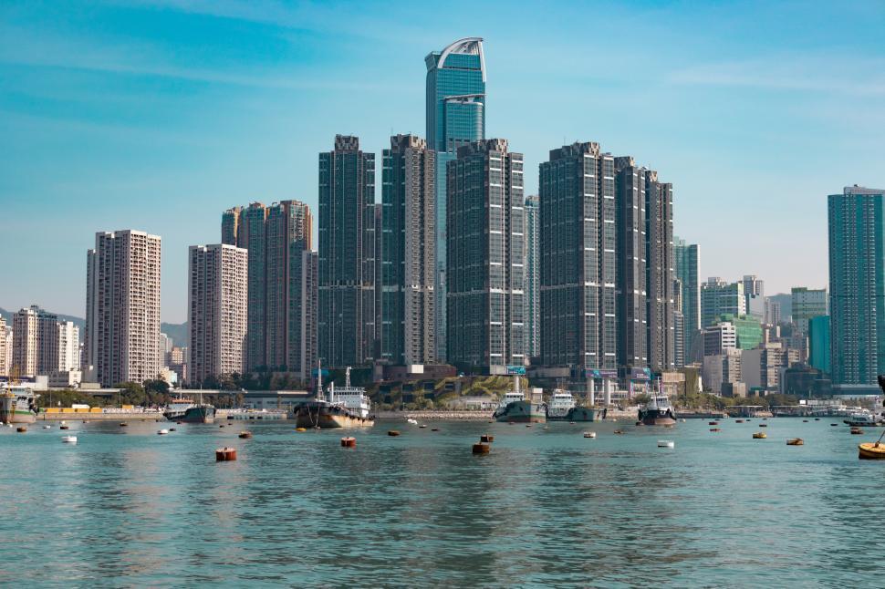 Free Image of Urban Skyline Surrounding Large Body of Water 