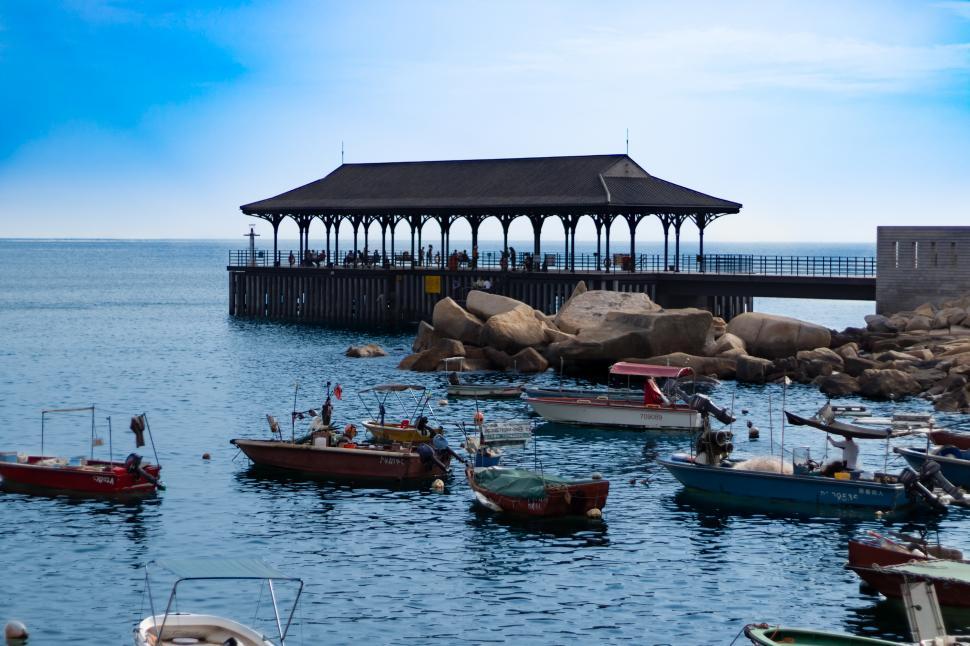 Free Image of Group of Boats Floating on Top of a Body of Water 
