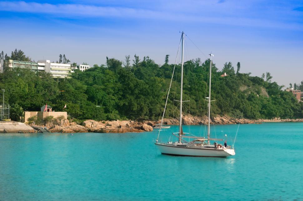 Free Image of Sailboat Floating in Middle of Water 