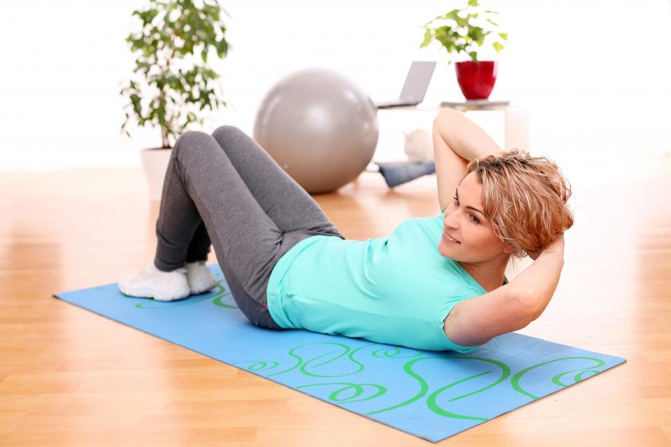 Free Image of Adult woman exercising on a yoga mat 