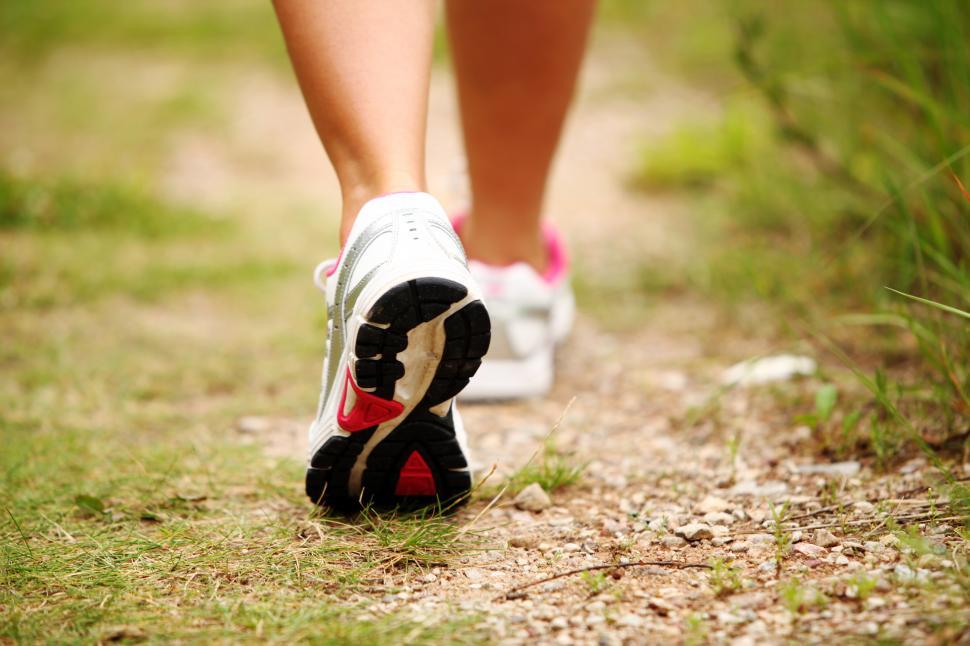 Free Image of Feet of a woman jogging on a trail 