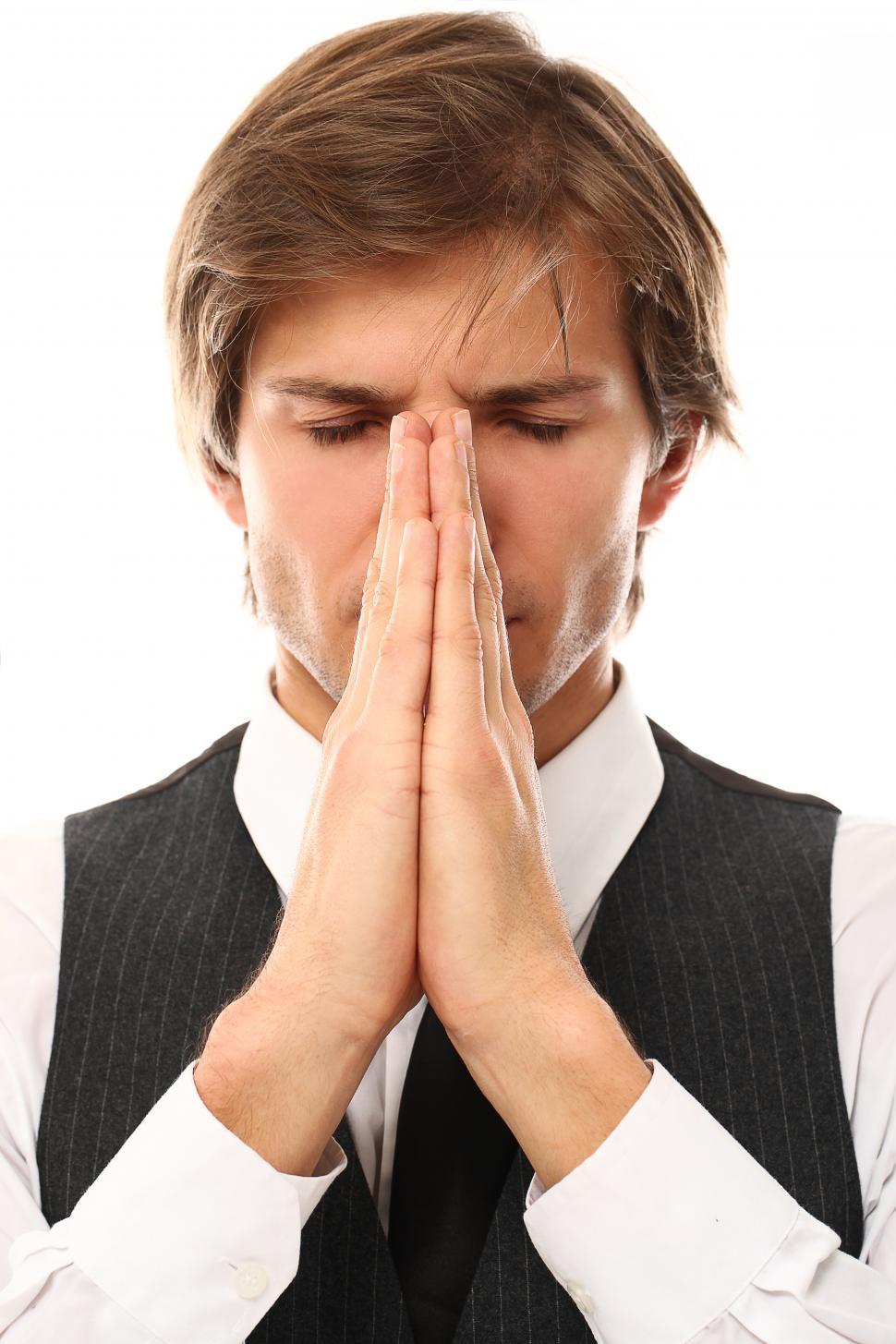 Free Image of Man with hands together as if in prayer 