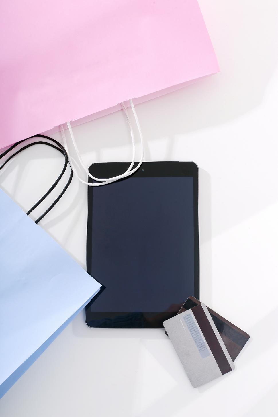 Free Image of Credit cards, tablet computer and shopping bags 