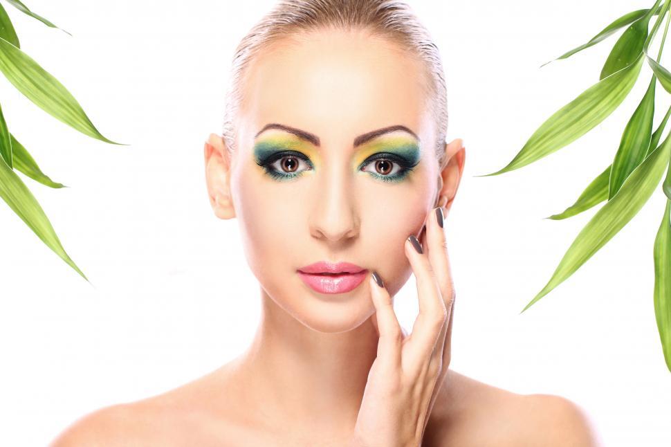 Free Image of Beautiful woman with bamboo leaves 