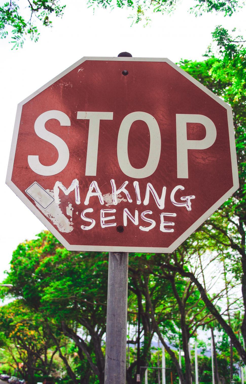 Free Image of Stop sign board with trees 