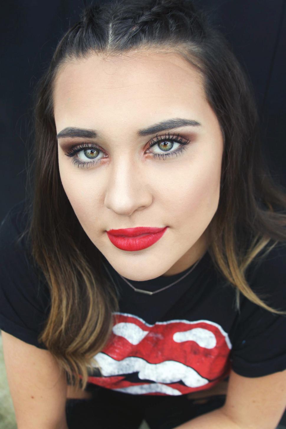 Free Image of Close up of young girl face with red lips - eye contact 