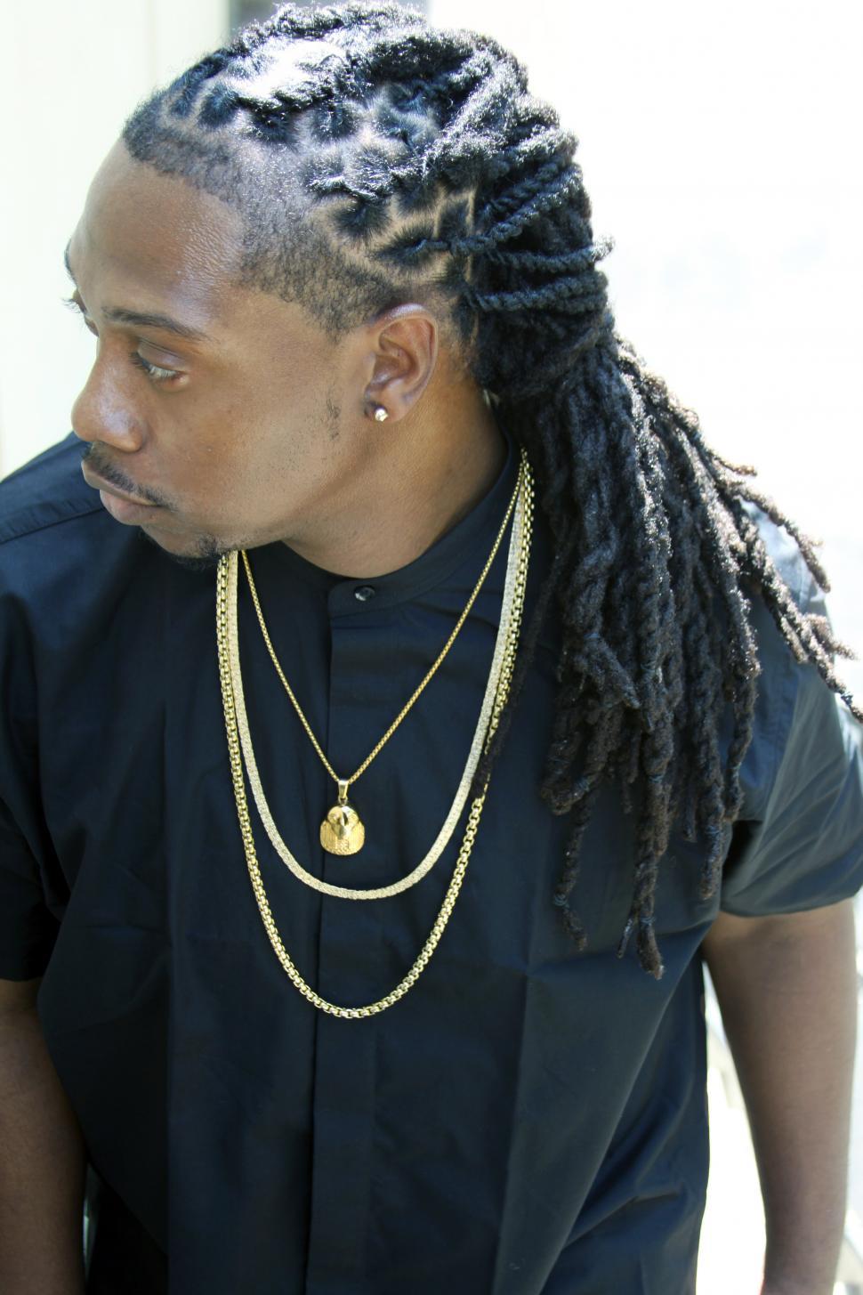 Free Image of Male fashion model with hip hop style clothing 