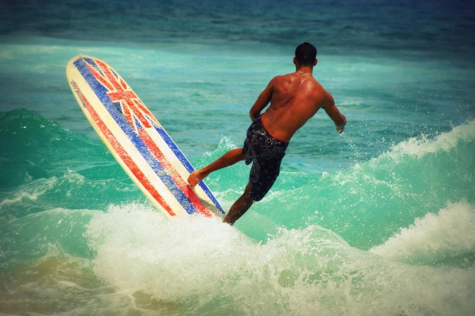 Free Image of Male surfer surfing in ocean 