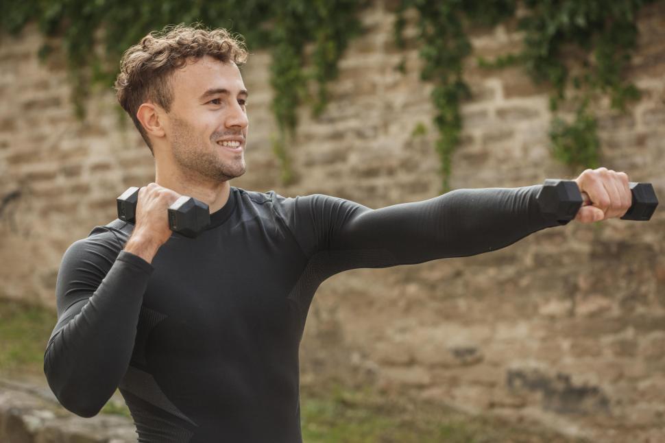 Free Image of Young man with dumbbells 