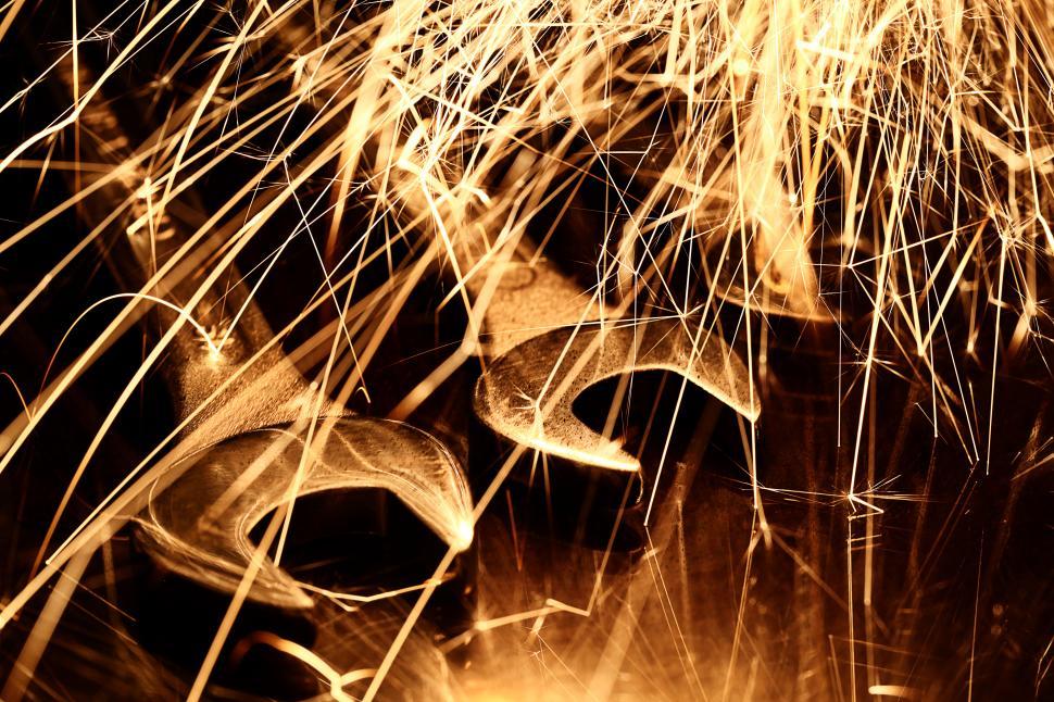 Free Image of Sparks fly over metal tools 