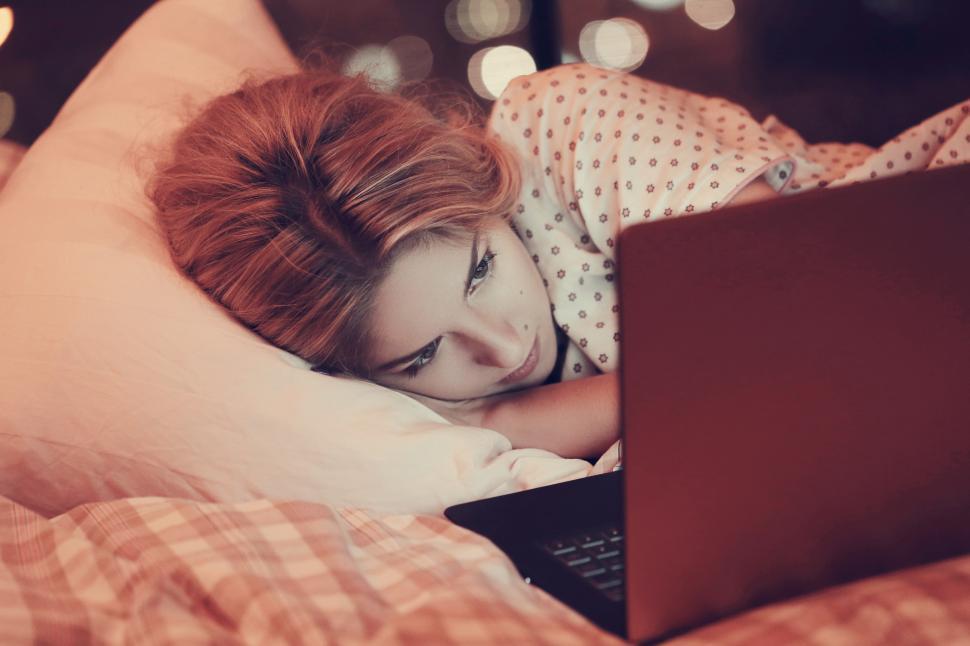 Free Image of Watching something on a laptop in bed 