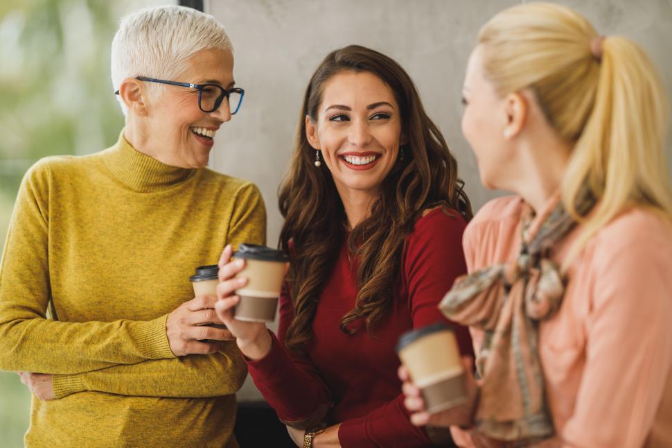 Free Image of Female coworkers sharing a joke in office 