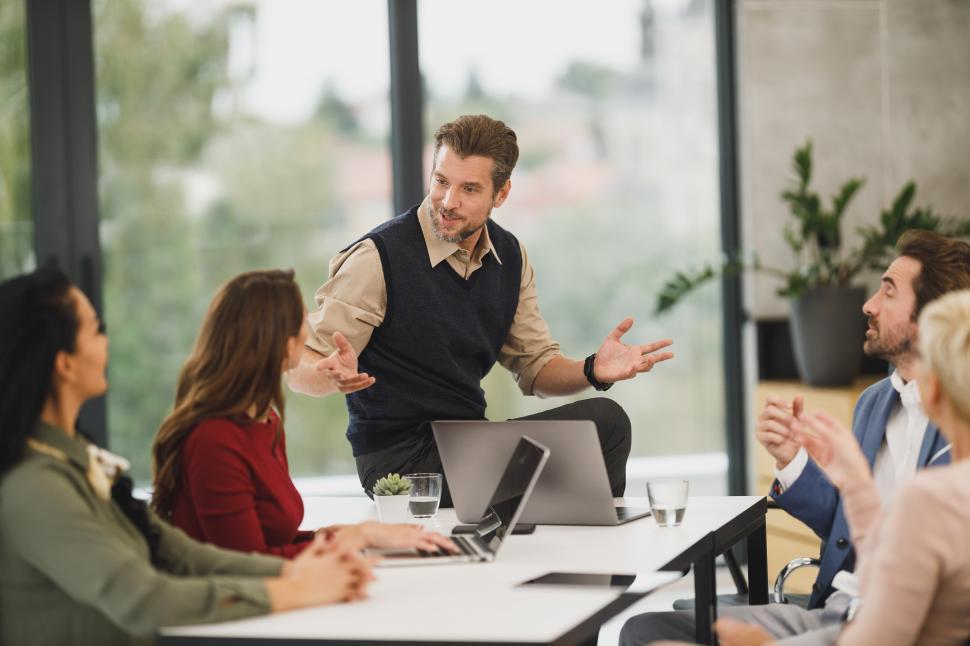 Free Image of Team of young managers discussing project in office 