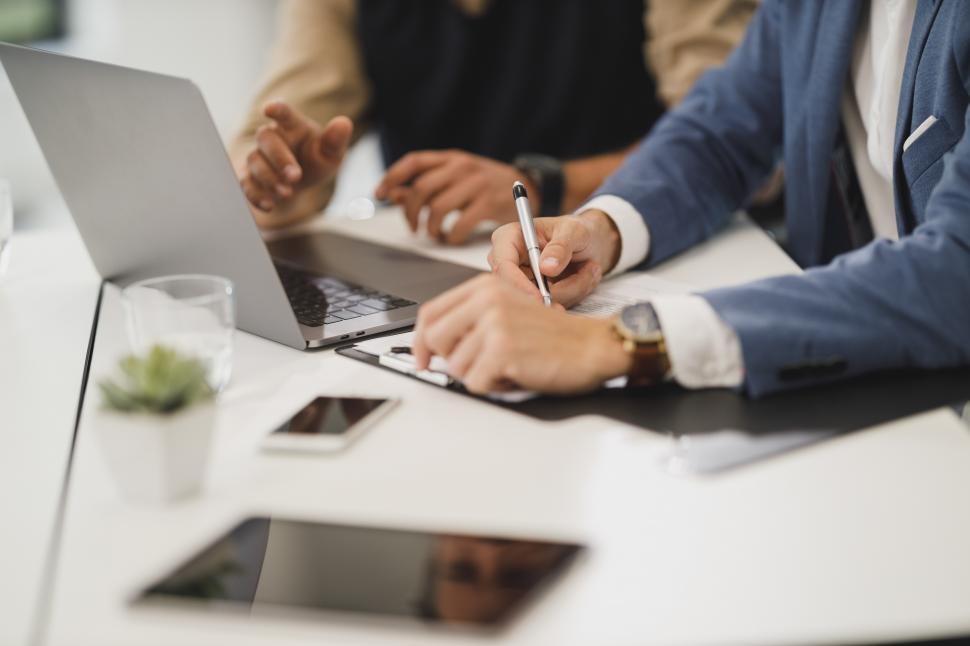 Free Image of Office workers checking papers with pen in office 