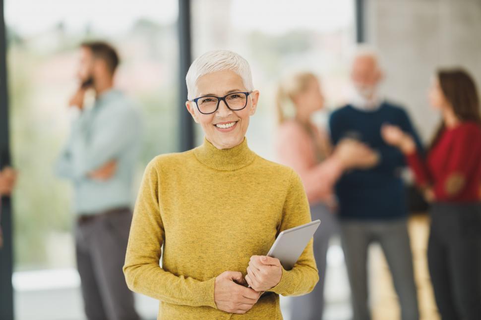 Free Image of Female office worker in glasses posing with confidence in office 
