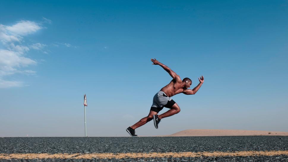 Free Image of Young male athlete on road 