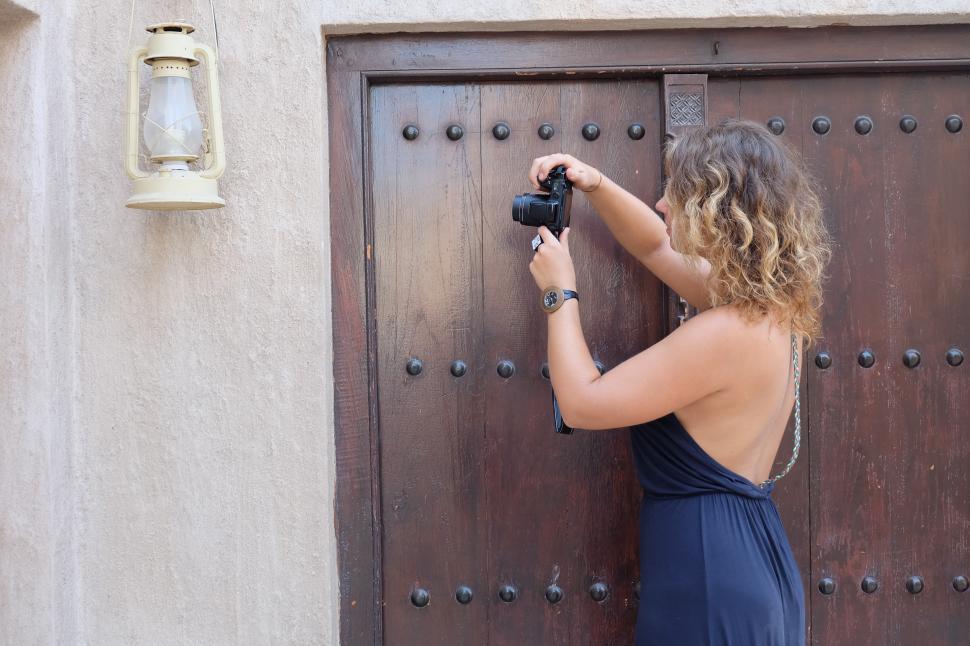 Free Image of Female photographer with camera and lantern 