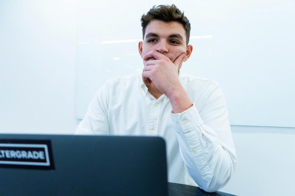 Free Image of Thoughtful businessman with laptop 