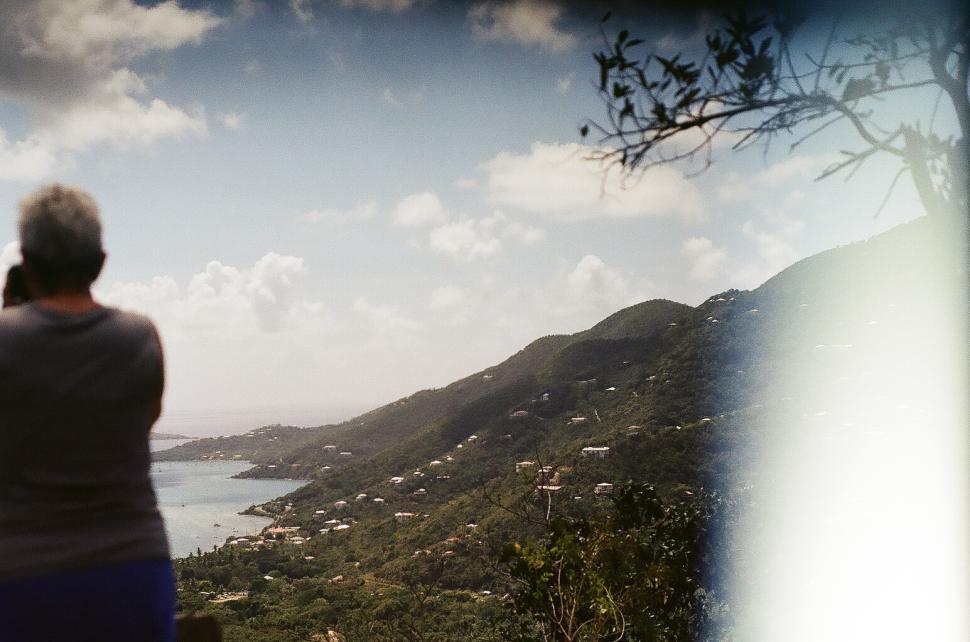 Free Image of Back side view of one person standing on the mountain 