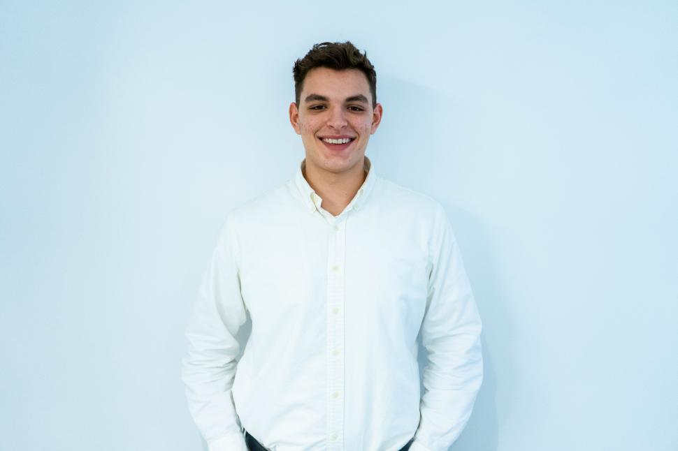 Free Image of Happy male professional posing in the office 