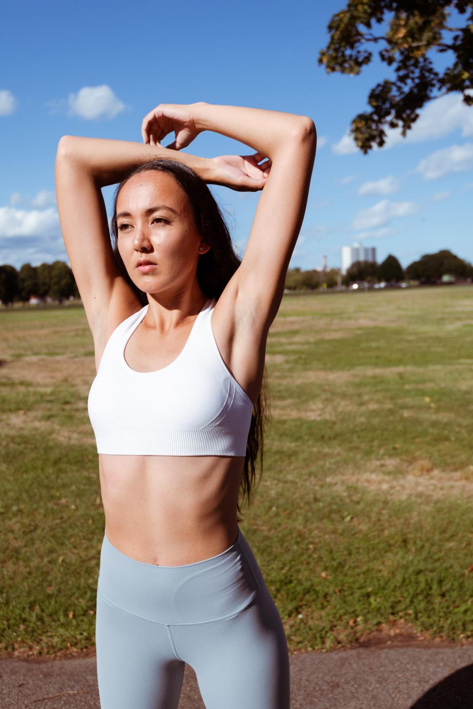 Free Image of Woman doing exercise on the track 
