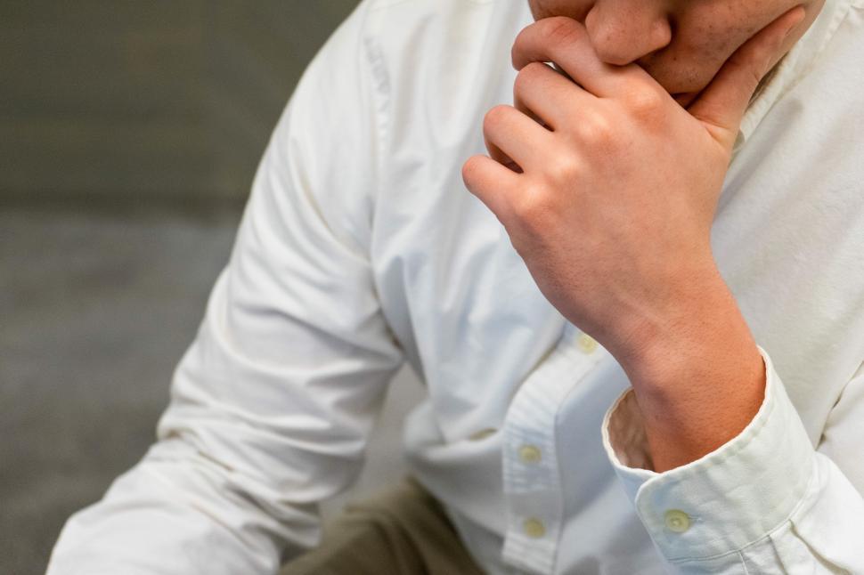 Free Image of Young man thinking in office 