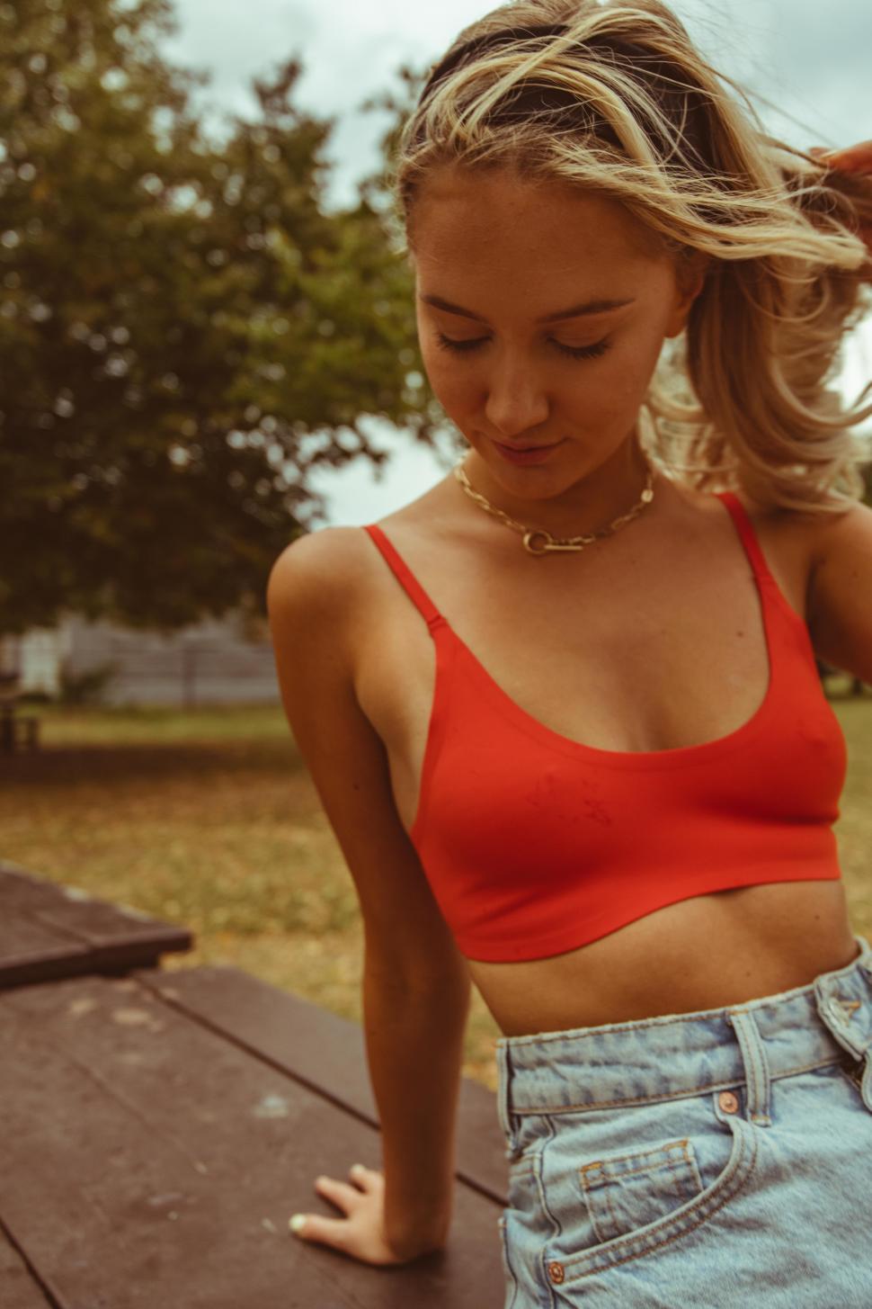 Free Image of Female fashion model with blonde hair in park 