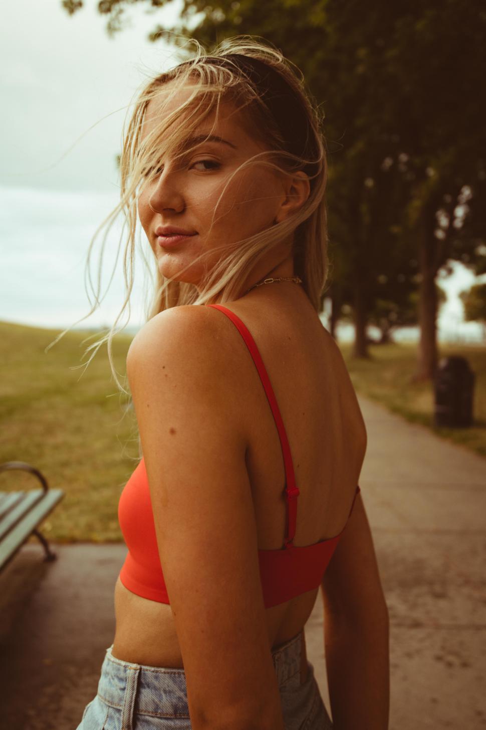 Free Image of Portrait of young woman with blonde hair in park - looking at camera 