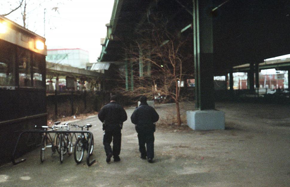 Free Image of Two men walking on the street 