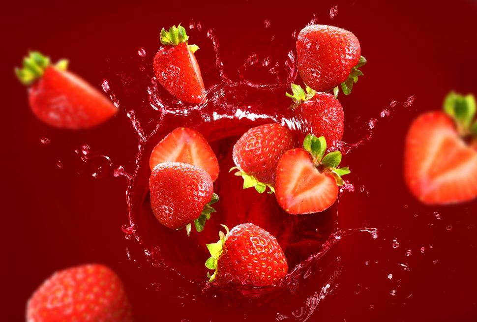 Free Image of Strawberry falling into a wet splash 