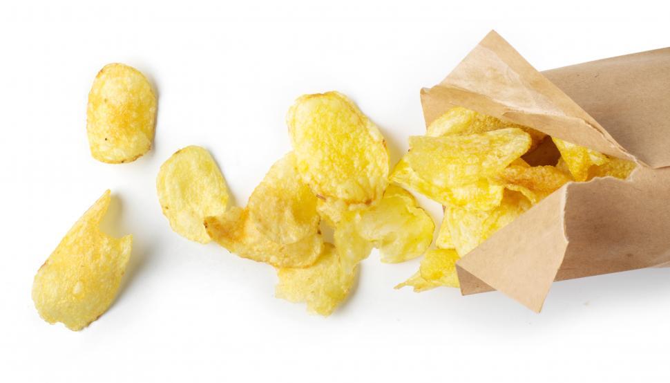 Free Image of Potato Chips spilled on the table 