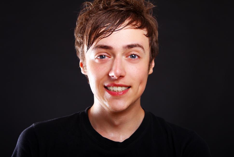 Free Image of High key shot of young guy in dark shirt 
