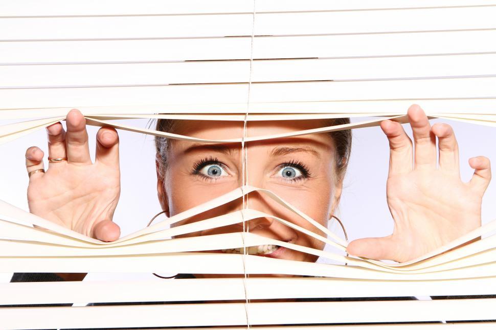 Free Image of Crazed woman looking out the window 