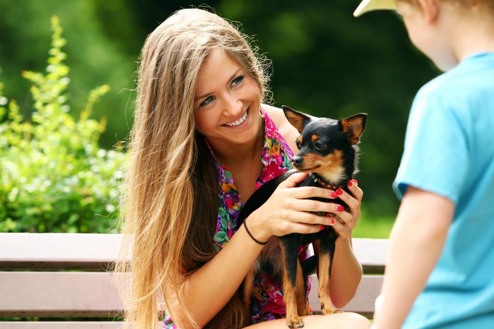 Free Image of Young woman showing her small doggy 