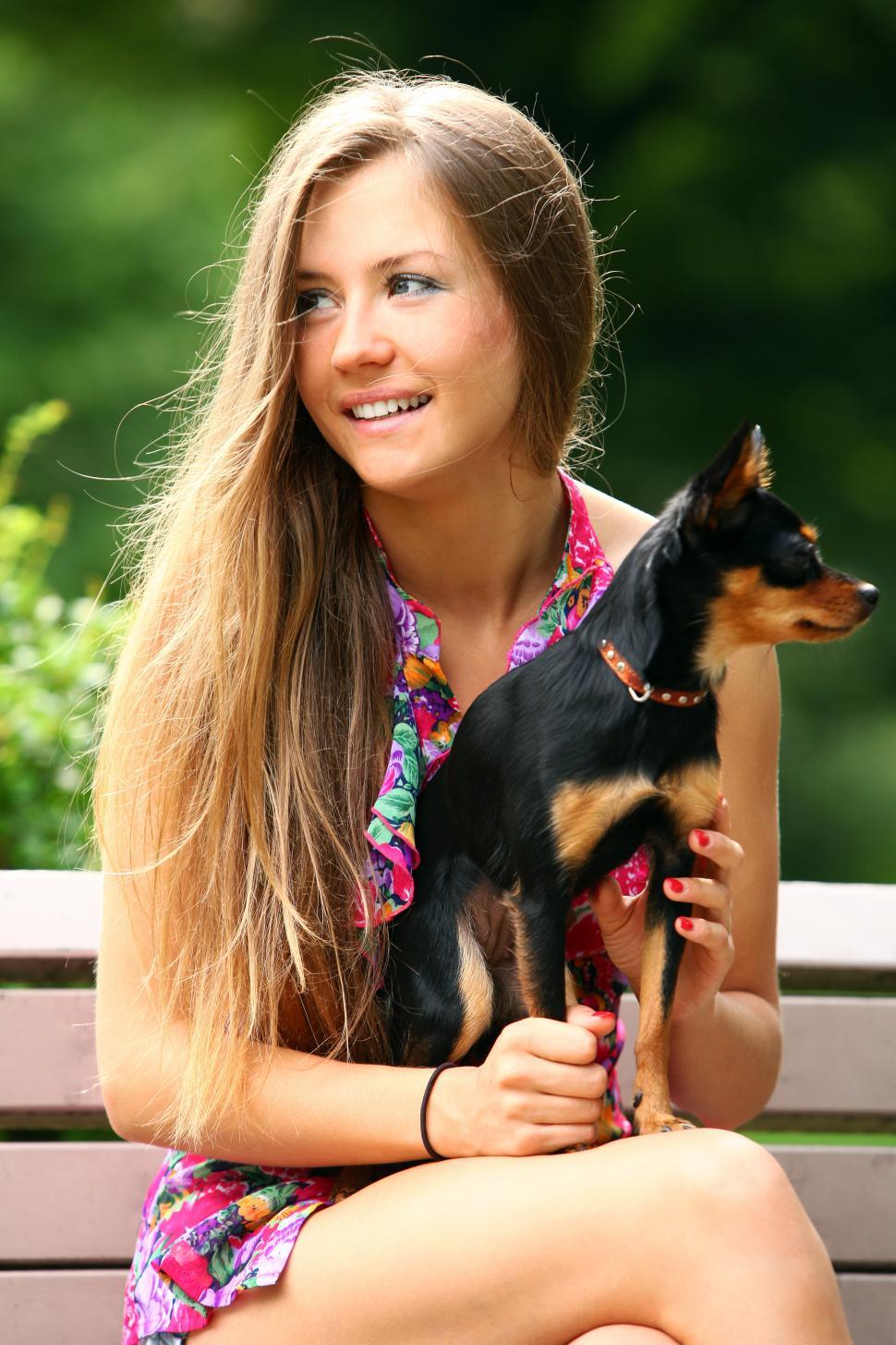Free Image of Young and happy girl with her cute dog 