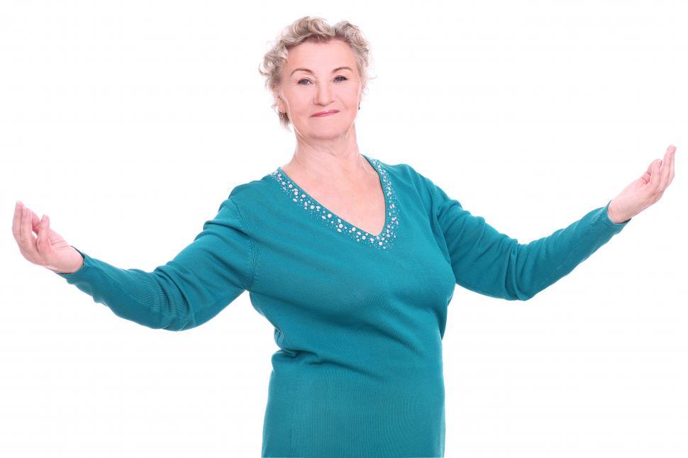 Free Image of Elderly woman arms wide, looking happy 