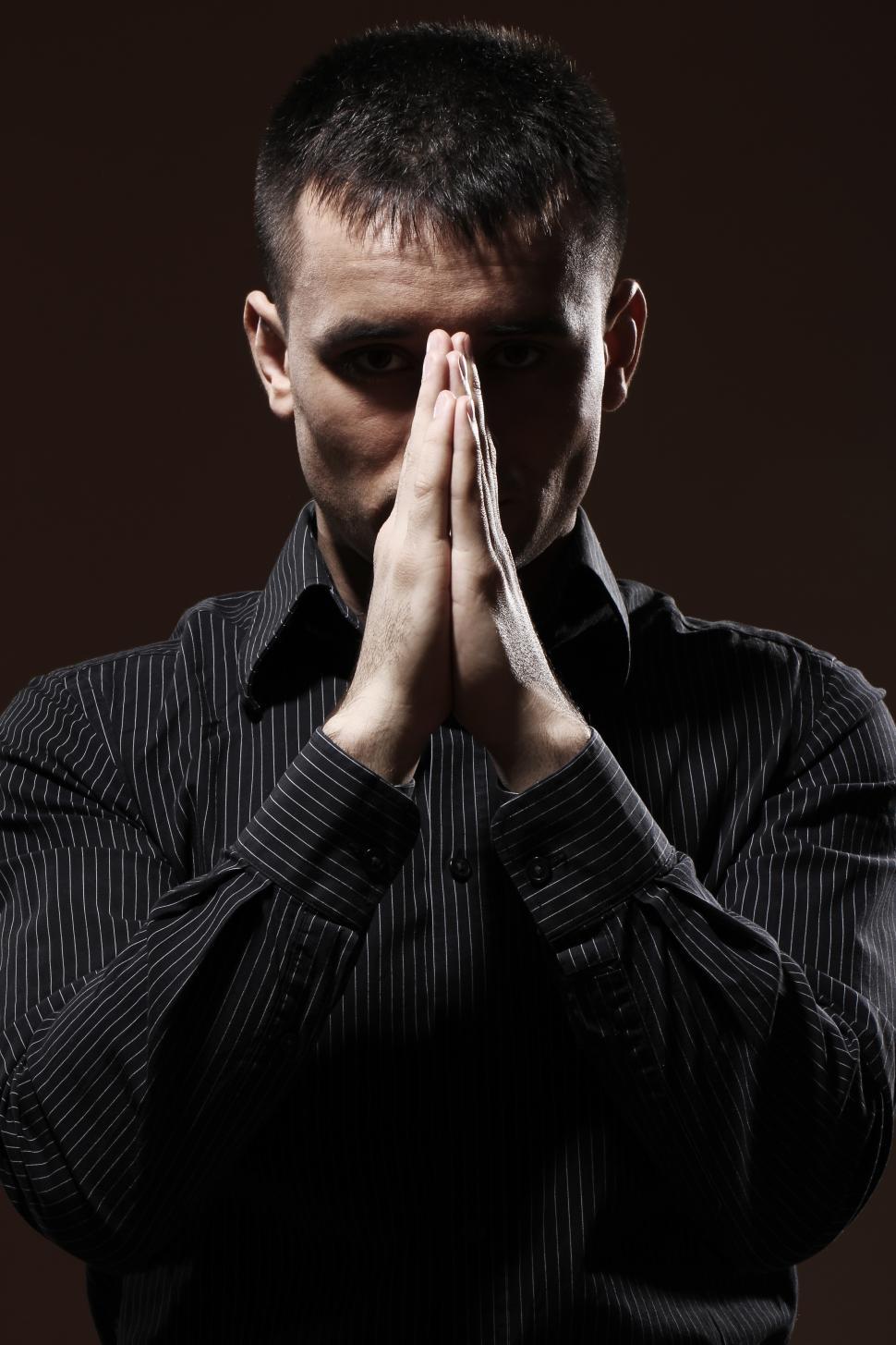 Free Image of Serious businessman, hands together in front of face 