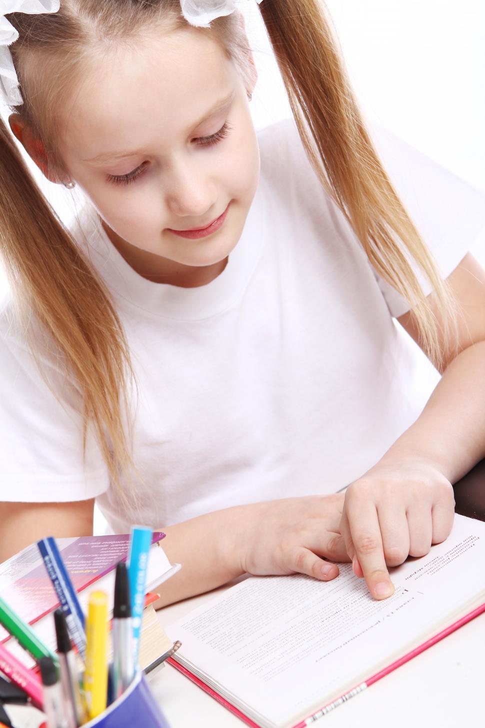 Free Image of School girl sitting at the desk 
