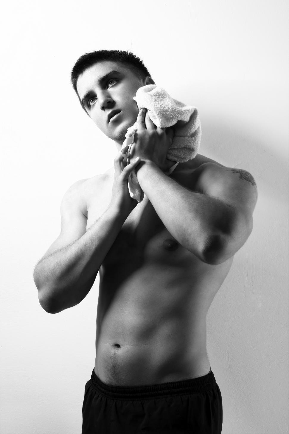 Free Image of Young and muscular guy with towel 