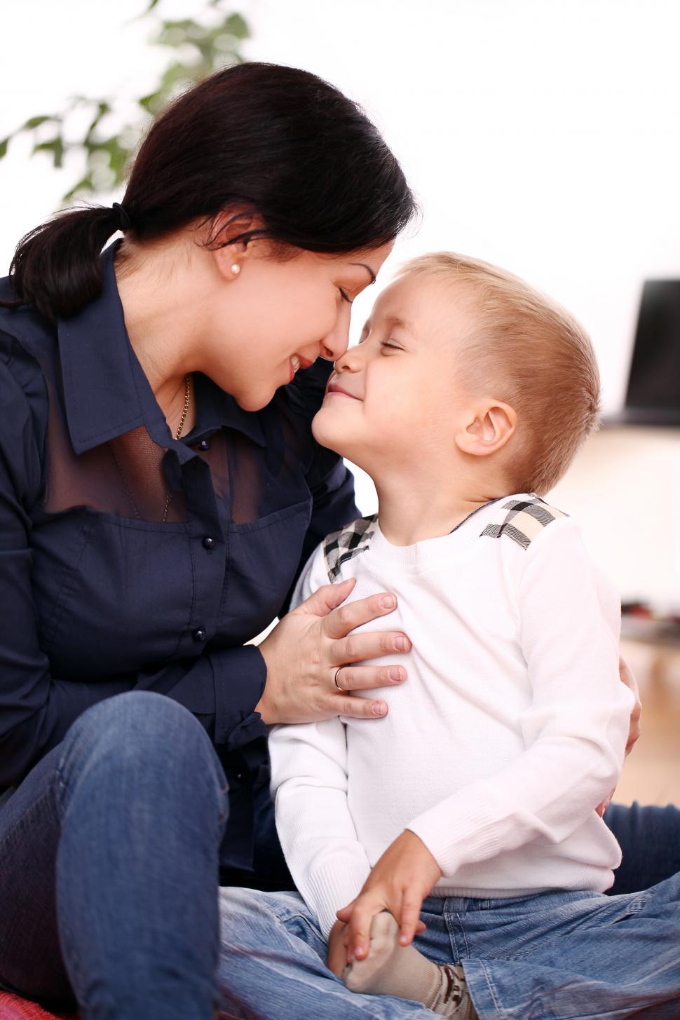 Free Image of Mother affectionately rubs noses with her child 