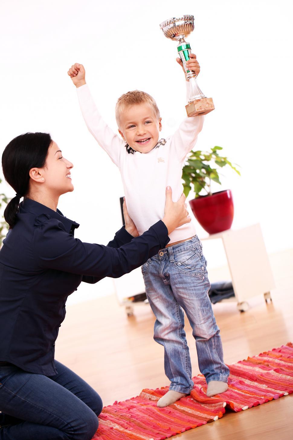 Free Image of Little kids wins a trophy 