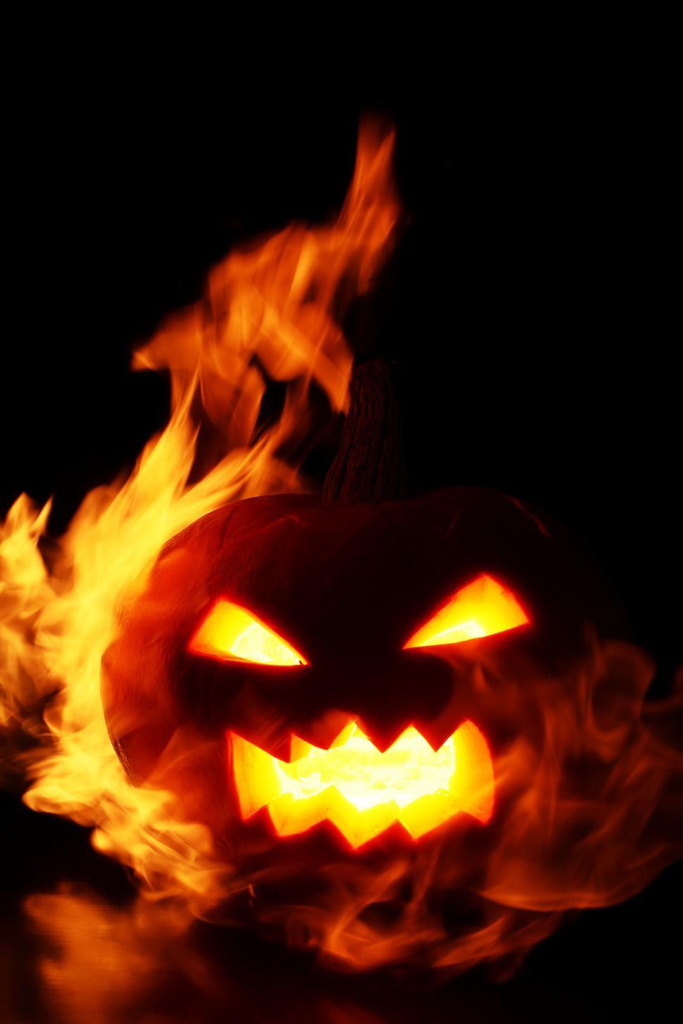 Free Image of Carved pumpkin engulfed in flames 