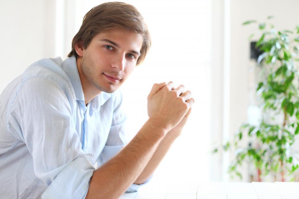 Free Image of Guy leaning on his elbows 