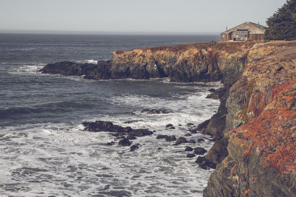 Free Image of Rugged Shorline with House on Bluff 