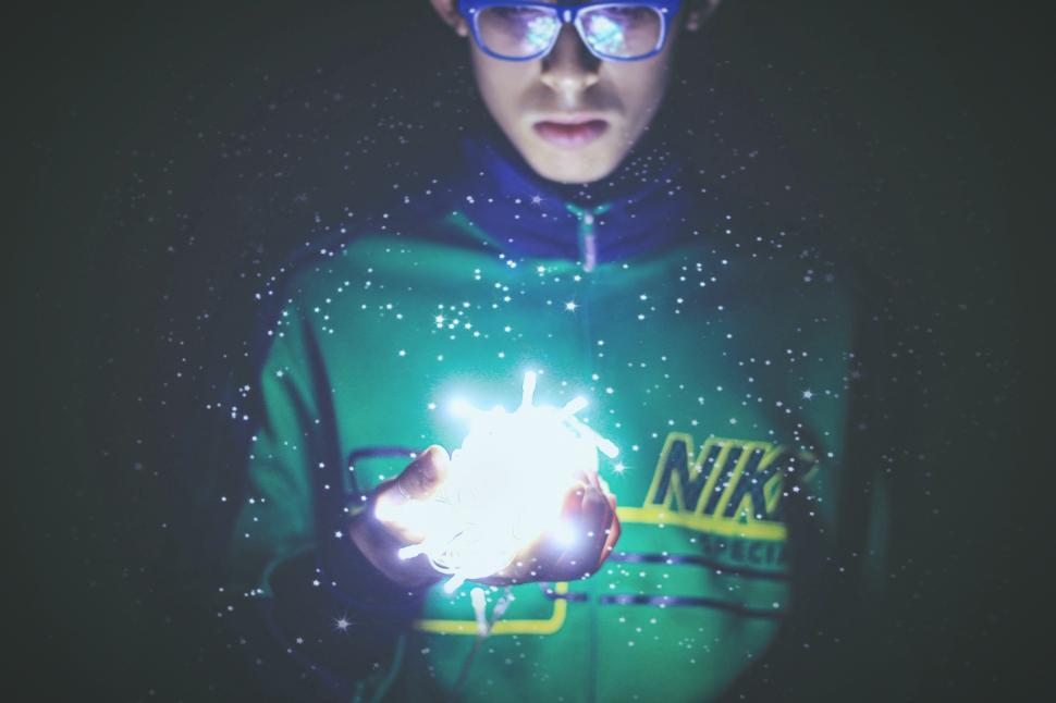 Free Image of Man with fairy lights in hand 