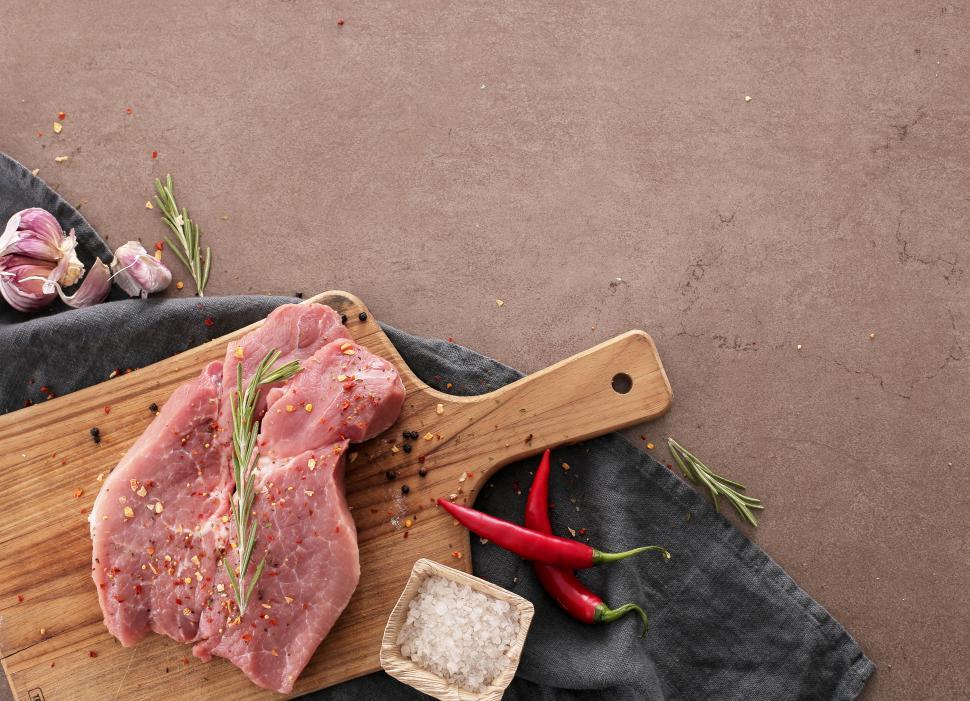 Free Image of Raw meat on board with copyspace 
