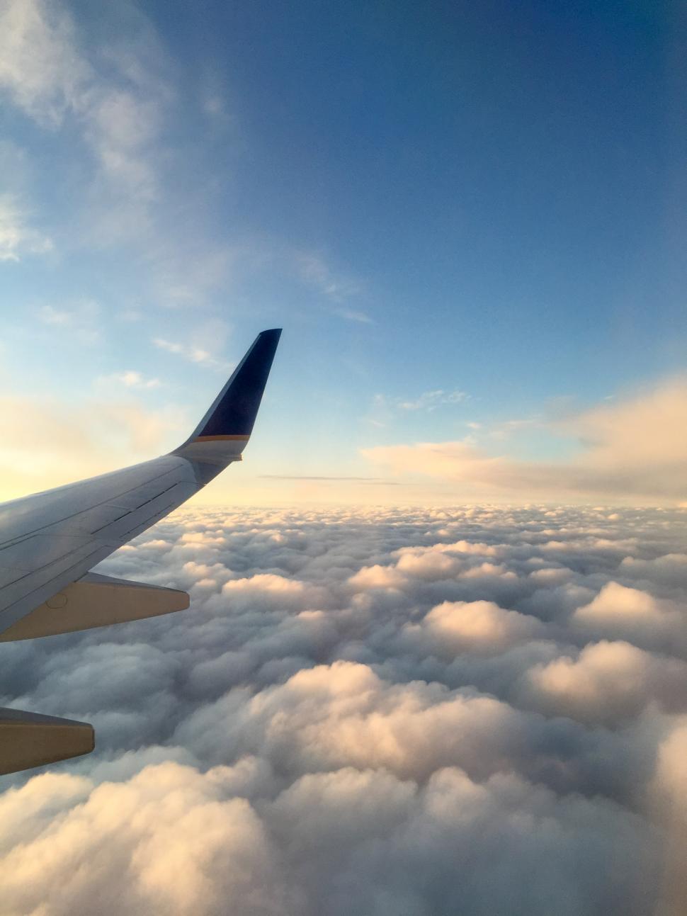 Free Image of Airplane wings and clouds 