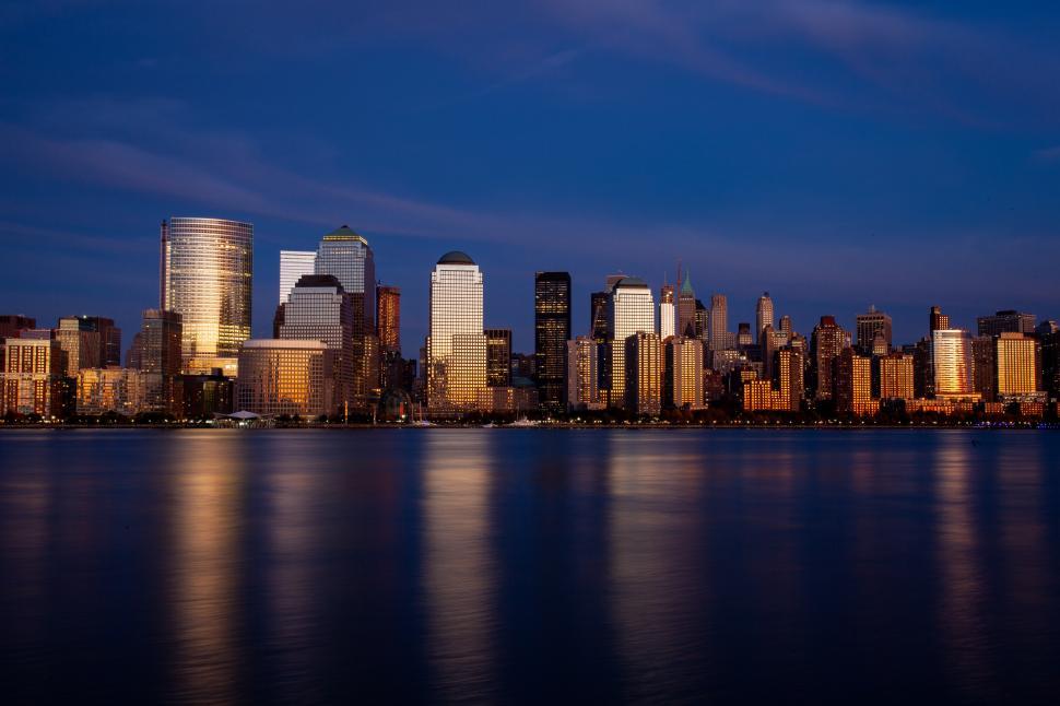 Free Image of Night view of city buildings with sea 