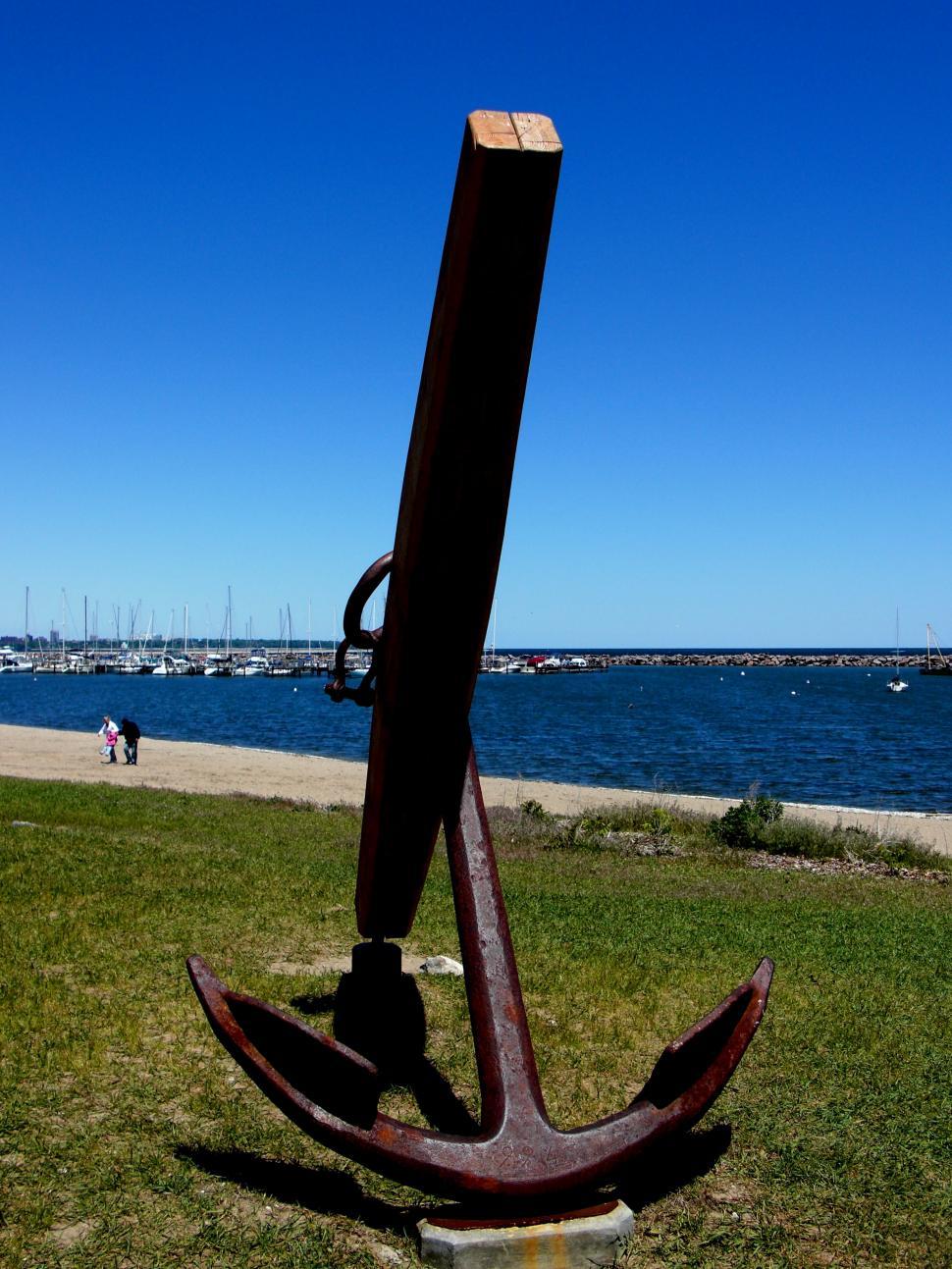 Free Image of Large Metal Anchor on Lush Green Field 